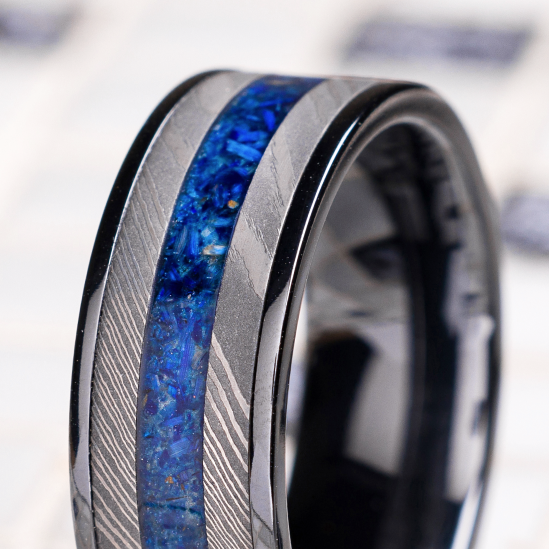 7 mm wide/Flat/Zirconium band featuring inlays of Damascus and 14K Yellow Gold.
