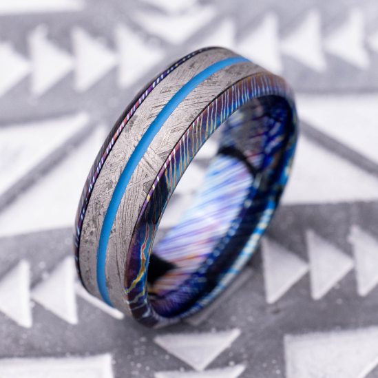 7 mm wide/Beveled/Titanium Damascus band featuring inlays of Meteorite and 14K Yellow Gold.